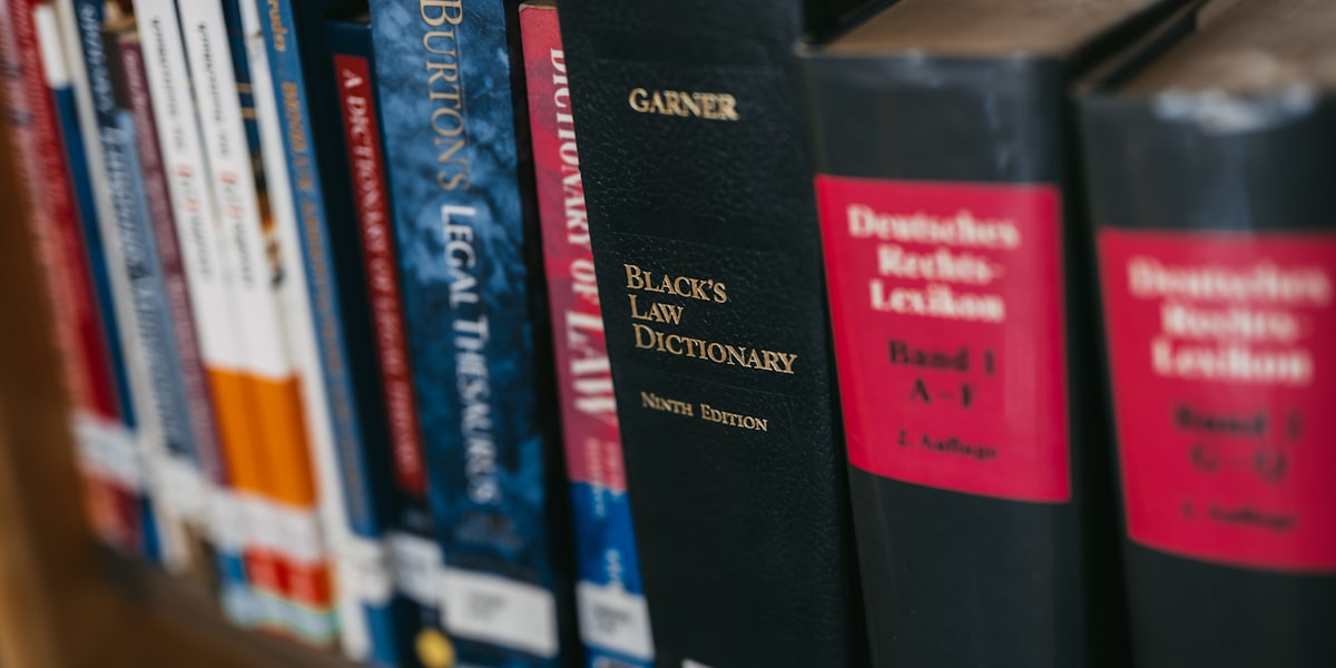 Law books on a shelf in a legal office library